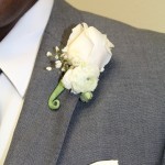 rose and ranunculus boutonniere